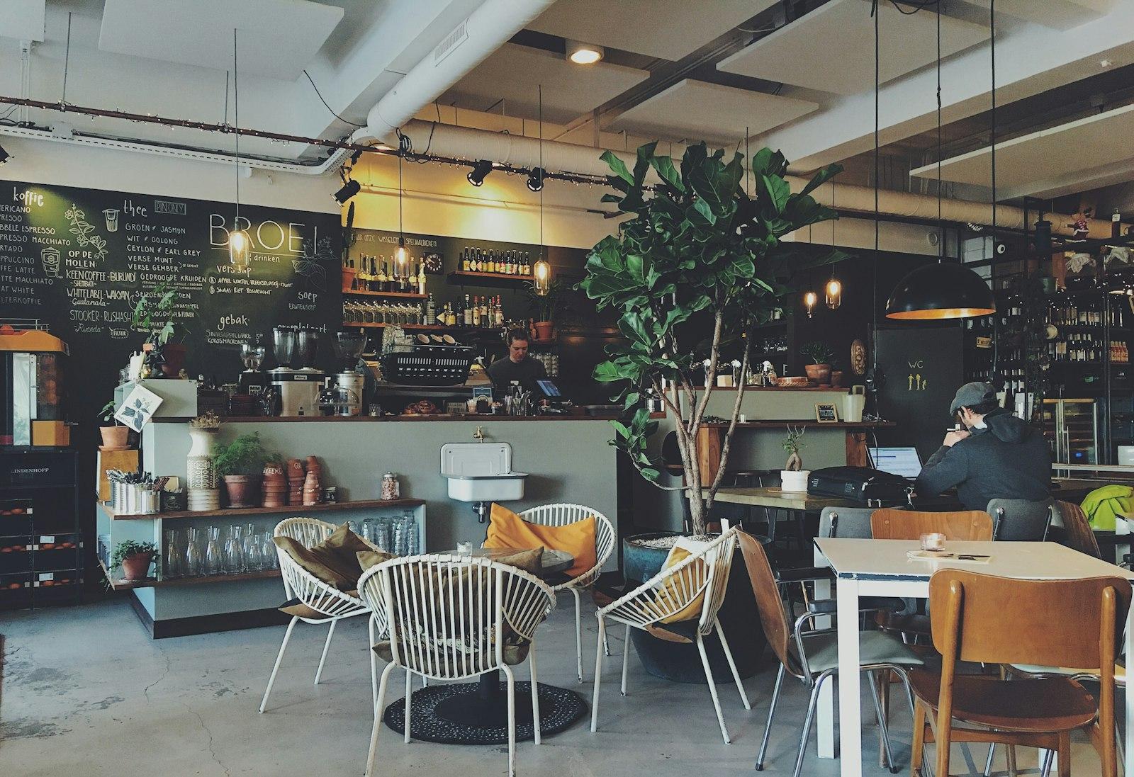 A neighbourhood cafe counter with a chalkboard menu